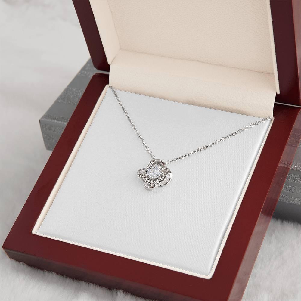 Stunning 18K gold love knot necklace