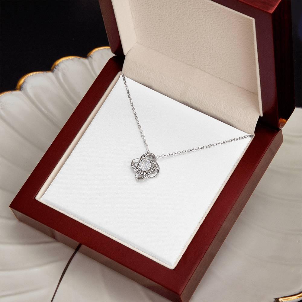 Stunning 18K gold love knot necklace